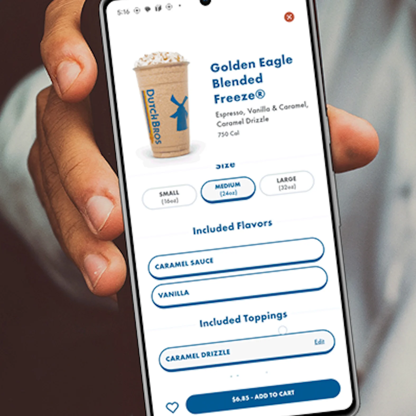 Hand holding smartphone displaying Dutch Bros Golden Eagle Blended Freeze drink order with size options and flavor selections.