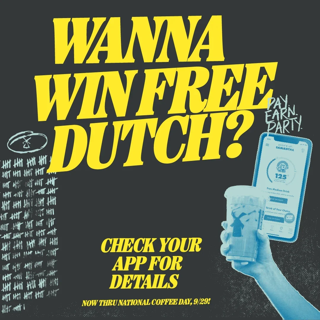 Promotional image with yellow text "WANNA WIN FREE DUTCH?" showing a hand holding a phone with app details for National Coffee Day.