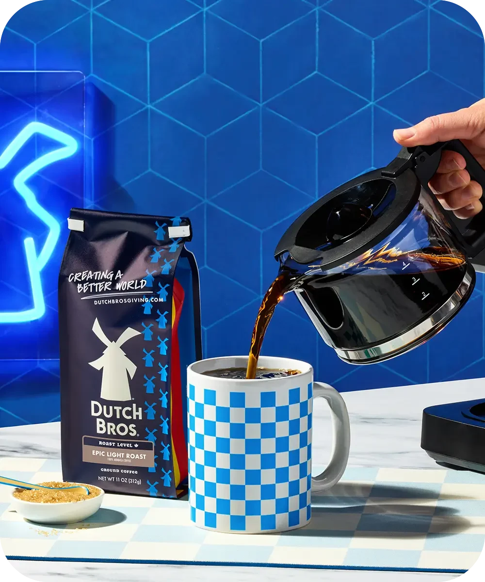 epic light roast ground coffee with coffee being poured into cup