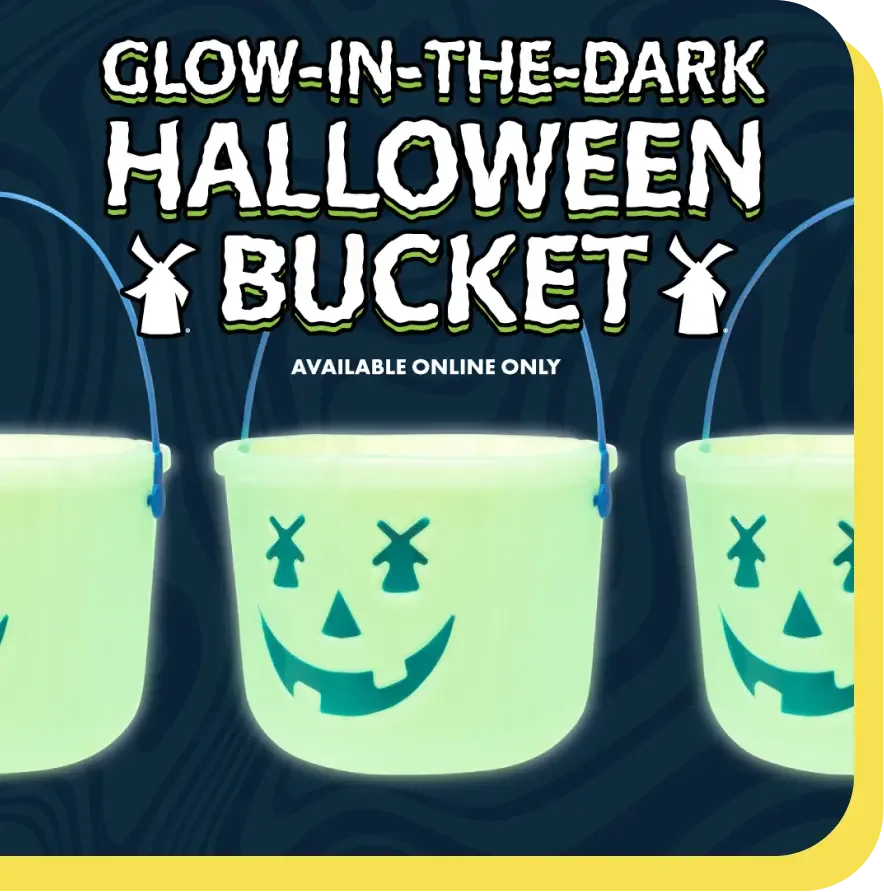 Glowing green Halloween buckets with jack-o'-lantern faces, available online only, against dark blue background.