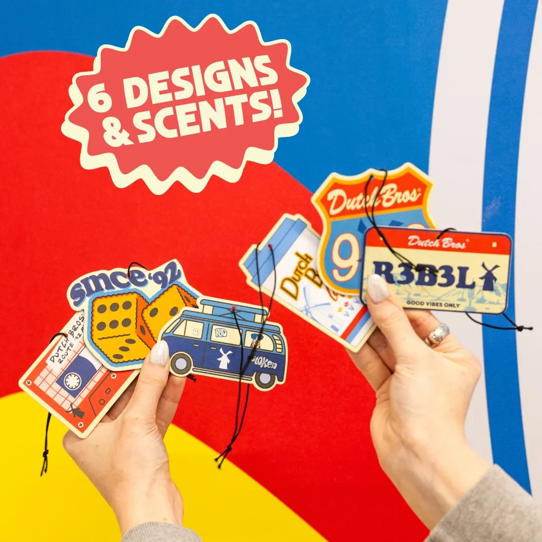 hands holding dutch air fresheners with 6 different designs and scents
