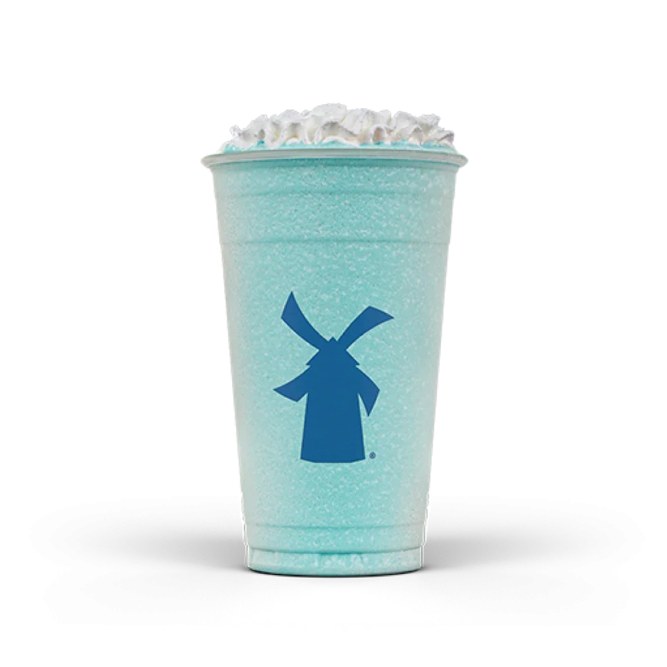 Blue frozen drink in a clear cup with whipped cream topping, featuring a blue windmill logo on the front.