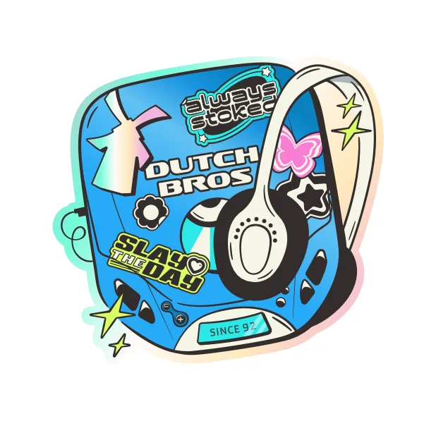 Blue retro cassette player with headphones featuring Dutch Bros logo and decorative stickers including "Slay the Day" text.