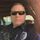 A uniformed officer is pictured with a straight face and cool shades