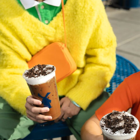 Dutch Bros customer holds a cold brew drink