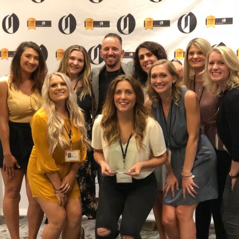 a group of women pose for a photo