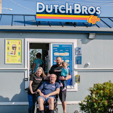 A family is shown outside a Dutch Bros location