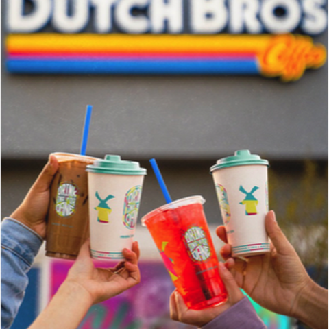 A group of customers cheers with their Dutch Bros cups outside a stand