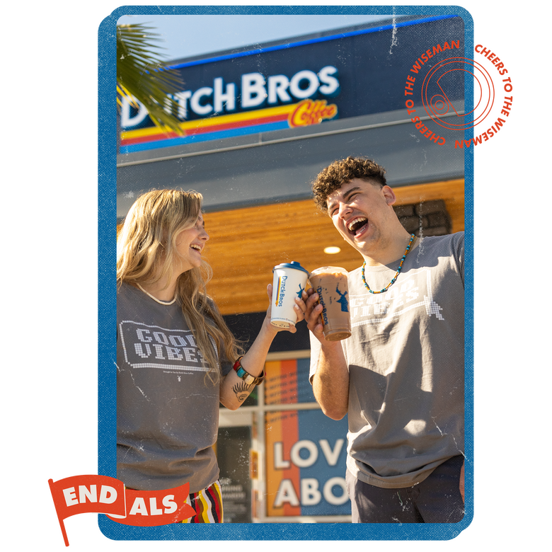A pair of happy people laughing and cheers their Dutch Bros drinks