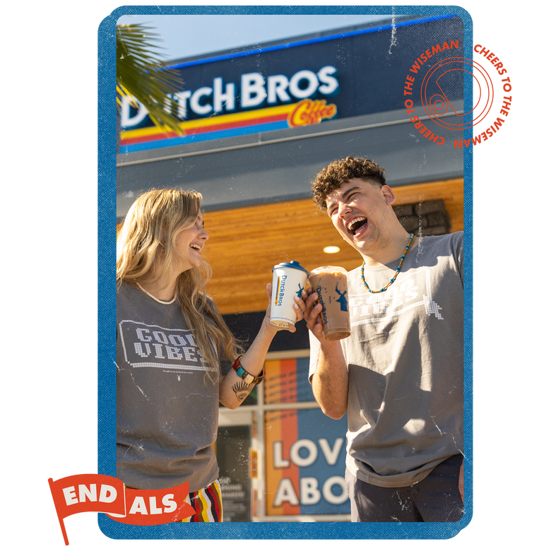 A pair of happy people laughing and cheers their Dutch Bros drinks